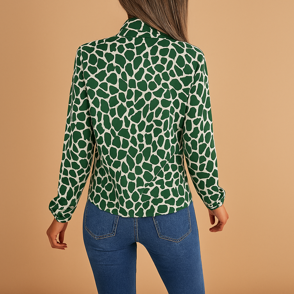Women’s elegant polka dot blouse with bow detail and elastic cuffs, perfect for both office wear and casual outings.