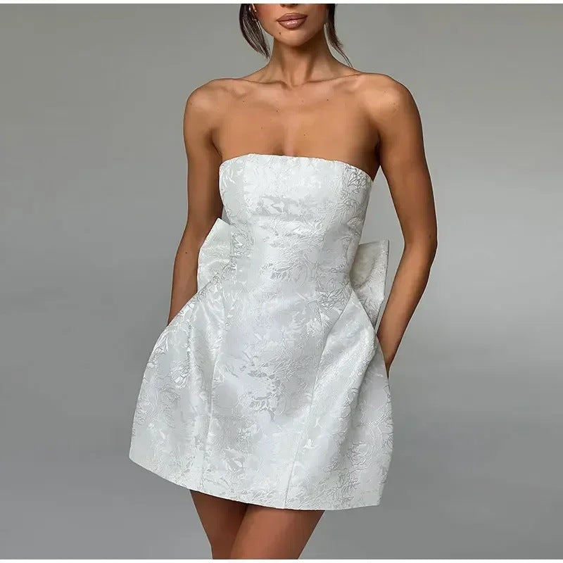 Chic Strapless Mini Dress with Bow Back Detail - Nocini