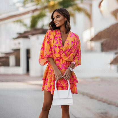 Chic Mini Dress with V Neck and Flirty Skirt - Nocini