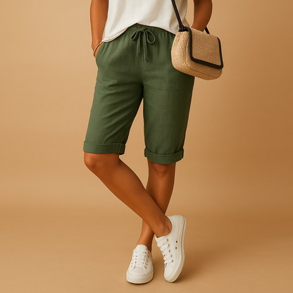 Capri pants with elastic waist and drawstring for women, featuring a relaxed fit and rolled hem. Perfect for casual summer days and evening outings.