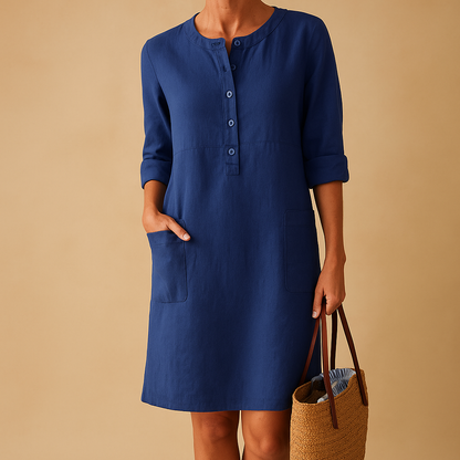 Casual women’s long shirt dress with rolled sleeves, side pockets, and button-down front, perfect for everyday comfort and relaxed style.