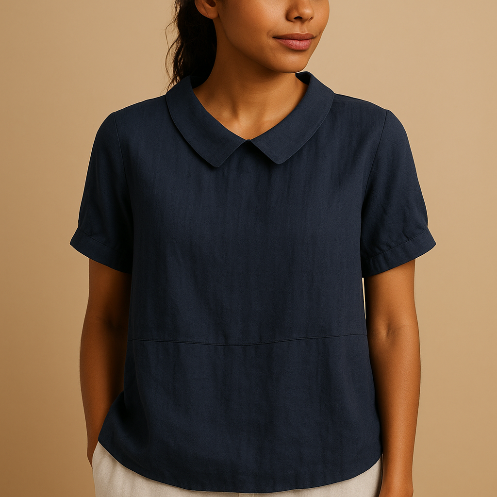 Women’s elegant tailored blouse with a classic design, suitable for office outfits, formal occasions, and smart casual looks.