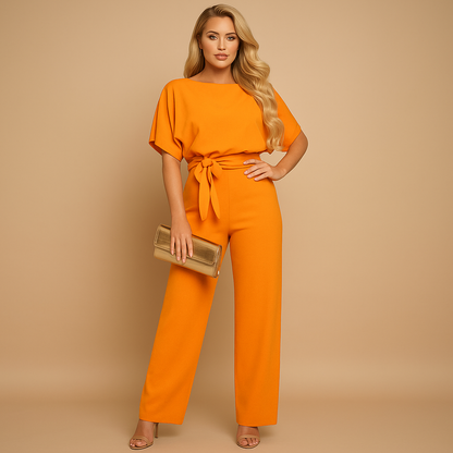 Glitter halter jumpsuit with open back for women, featuring flared legs and soft lining, perfect for parties, galas, and elegant evenings.