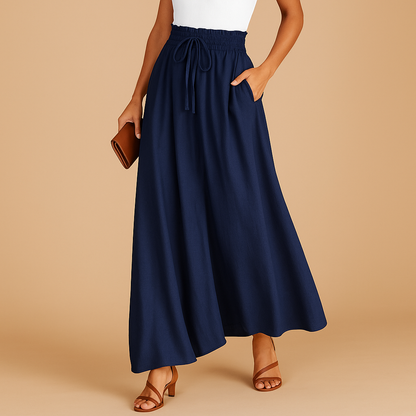 Women’s high-waist wide-leg pants with an elastic waistband, ideal for business, casual, or evening outfits.