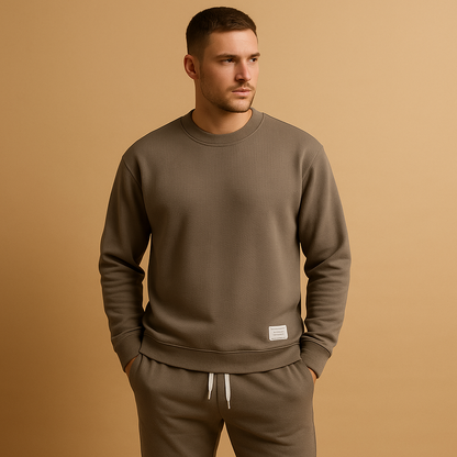 Modern men’s tracksuit with matching sweater and jogging jeans, perfect for leisure, casual wear, or light daily activities.