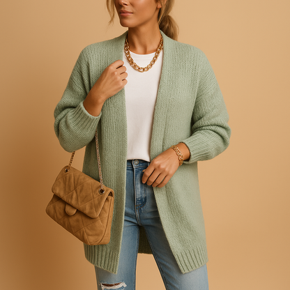 Women’s knitted cardigan with relaxed fit, open front, and breathable fabric, perfect for layering in winter and transitional seasons.
