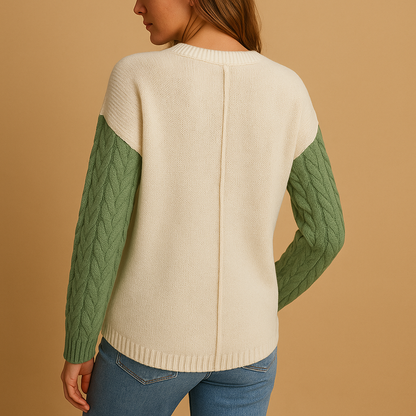 Women’s knitted sweater with cable pattern, relaxed fit, dropped shoulders, and pocket detail. Perfect for casual outfits, layering, or cozy days at home.