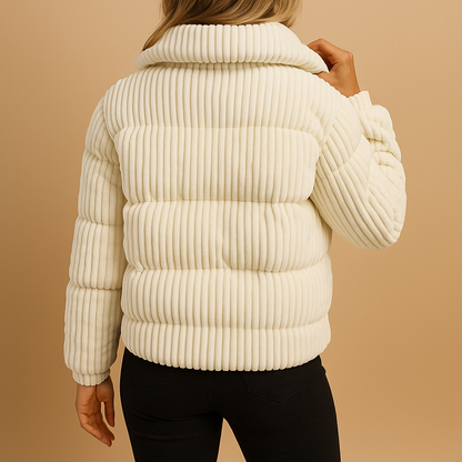 Women’s lightweight puffer jacket with a fitted silhouette, high collar, and zip closure, ideal for everyday wear and winter city walks.