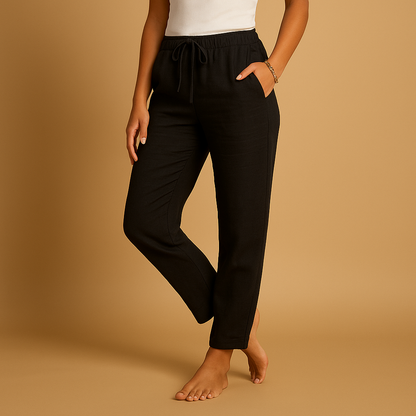Women’s lightweight trousers with elastic waistband and feminine cut, designed with flowy fabric for casual wear or formal occasions.