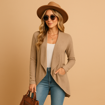 Women’s long knitted cardigan with soft texture and relaxed fit. Elegant layering piece in solid colors, ideal for work, casual outfits, and seasonal wear.