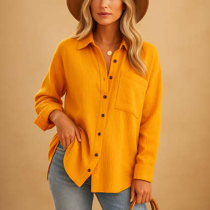 Long sleeve polo shirt for women with a relaxed fit, classic collar, and chest pocket, suitable for work and casual wear.