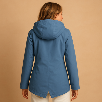 Women’s long waterproof raincoat with hood, breathable fabric, and stylish design. Ideal for commuting, walks, and everyday use on rainy days.