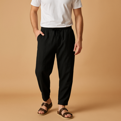 Men’s loose cotton pants with breathable fabric and relaxed fit, perfect for warm days, travel, or casual everyday wear.
