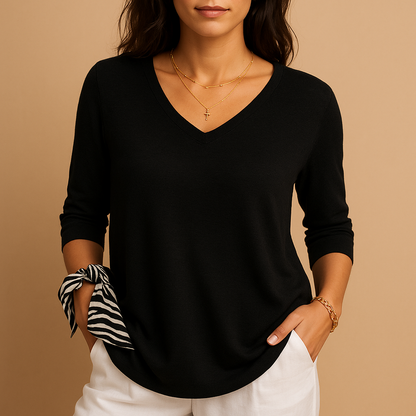 Elegant loose fit luxury top for women in soft neutral tones, perfect for daily wear or casual occasions.