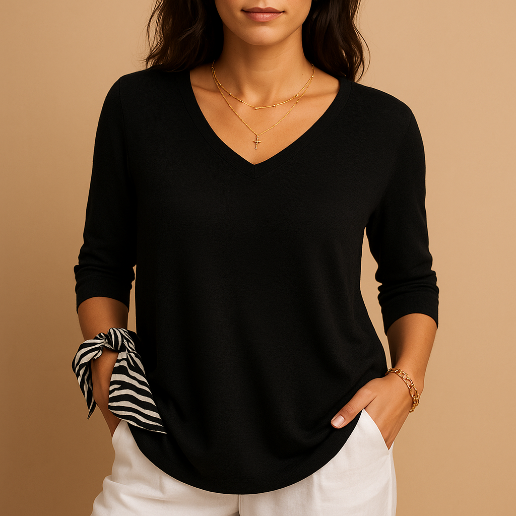 Elegant loose fit luxury top for women in soft neutral shades, perfect for everyday comfort or relaxed casual occasions.