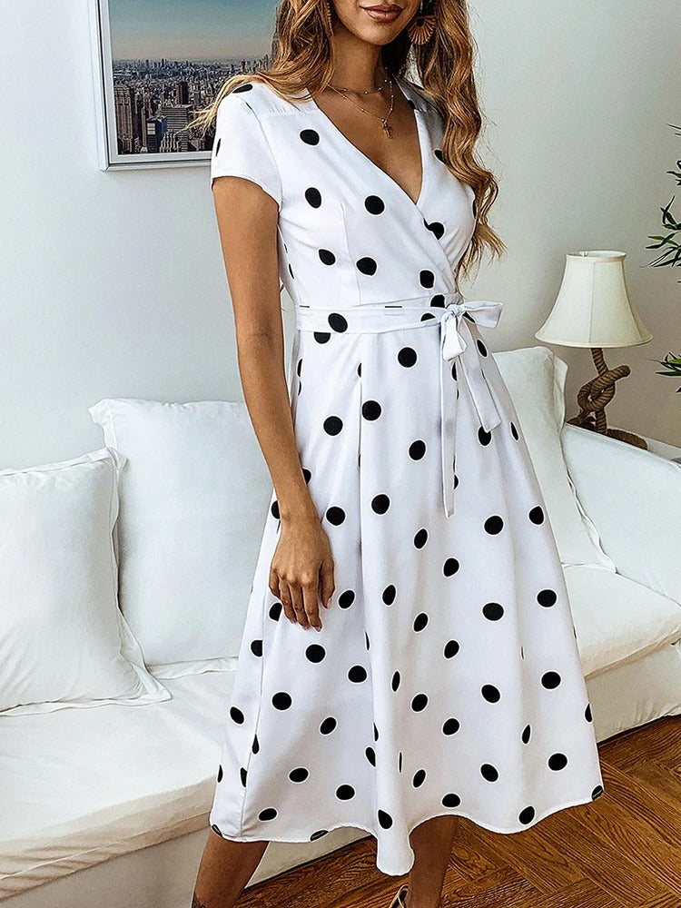 Floral is not present, but Polka Dot is, so: 
Women's Polka Dot Midi Dress - Nocini