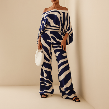 Women’s elegant two-piece summer set with off-shoulder blouse and wide-leg pants, perfect for dinners, vacations, and stylish everyday wear.