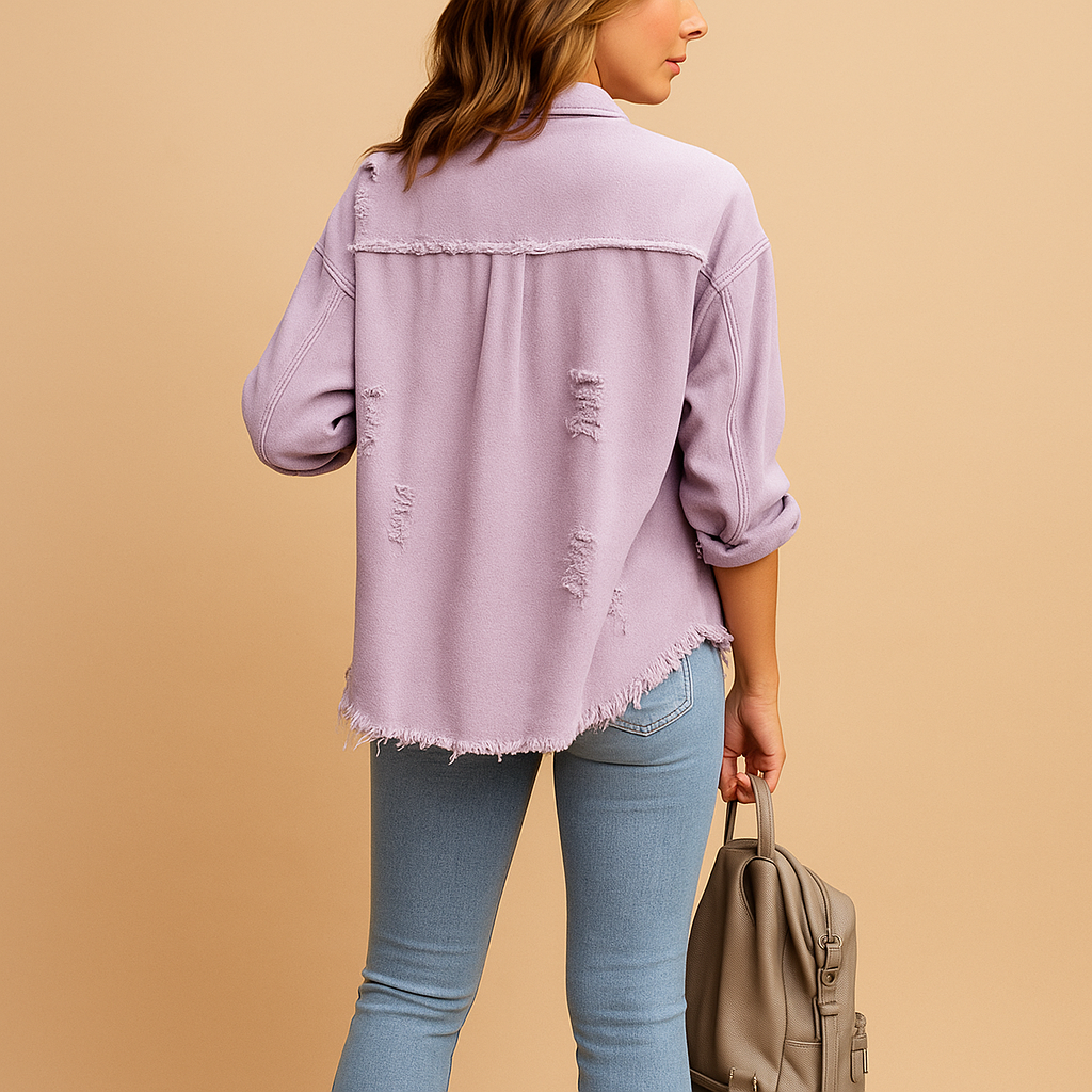 Oversized destroyed denim jacket for women with long sleeves and relaxed fit, perfect for casual outfits and city looks.