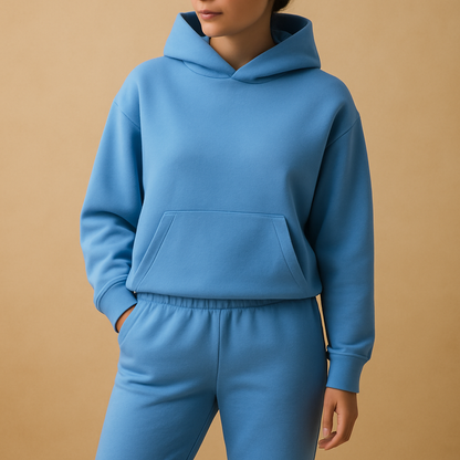 Oversized hoodie and jogger set for women with soft fabric and relaxed fit, available in beige, black, grey, light green, blue, pink, light blue, white, and dark green.