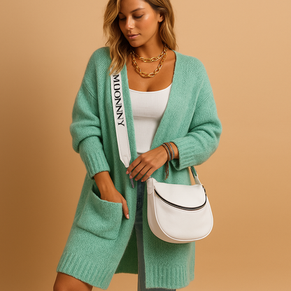 Women’s oversized open front cardigan with flowing fabric, chic tailored details, and neutral tones, ideal for layering in casual or stylish outfits.