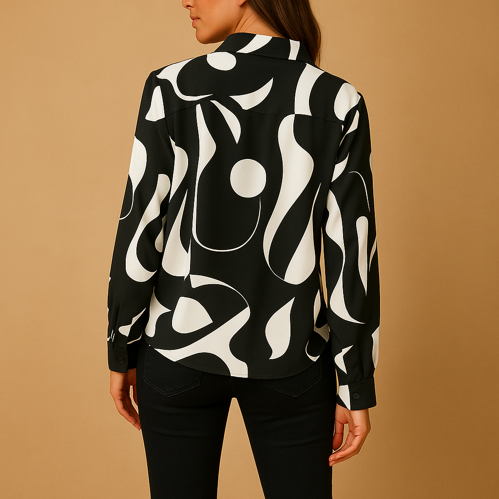 Elegant printed blouse for women in apricot and black, featuring a relaxed fit and refined, timeless design for all occasions.