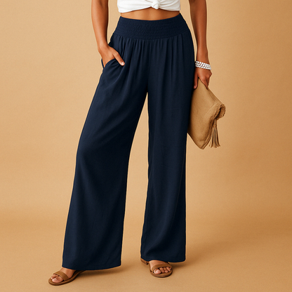 Women’s lightweight summer trousers with elastic waistband and loose straight legs, ideal for casual outings and relaxed summer days.