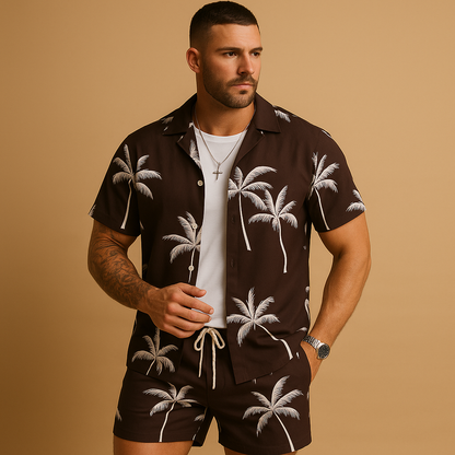 Tropical summer set for men with palm and feather print shirt and shorts, ideal for beach days, vacations, or relaxed summer outings.
