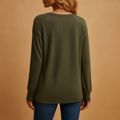 Women’s v-neck blouse with button details and a loose fit, suitable for everyday wear, office outfits, and smart casual looks.